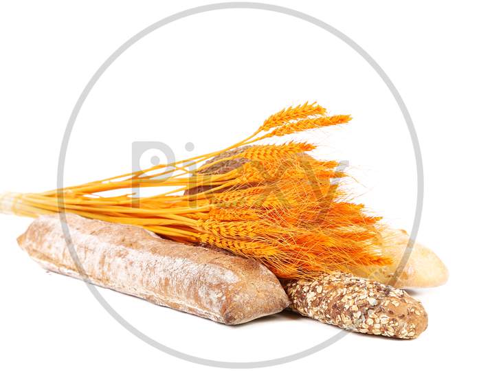 Grain Brown And White Bread With Ear Wheat. Isolated On A White Background.
