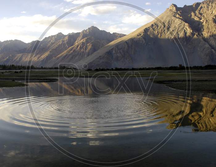 Lake In Ladakh With Mountains And Its reflection  on Water Surface