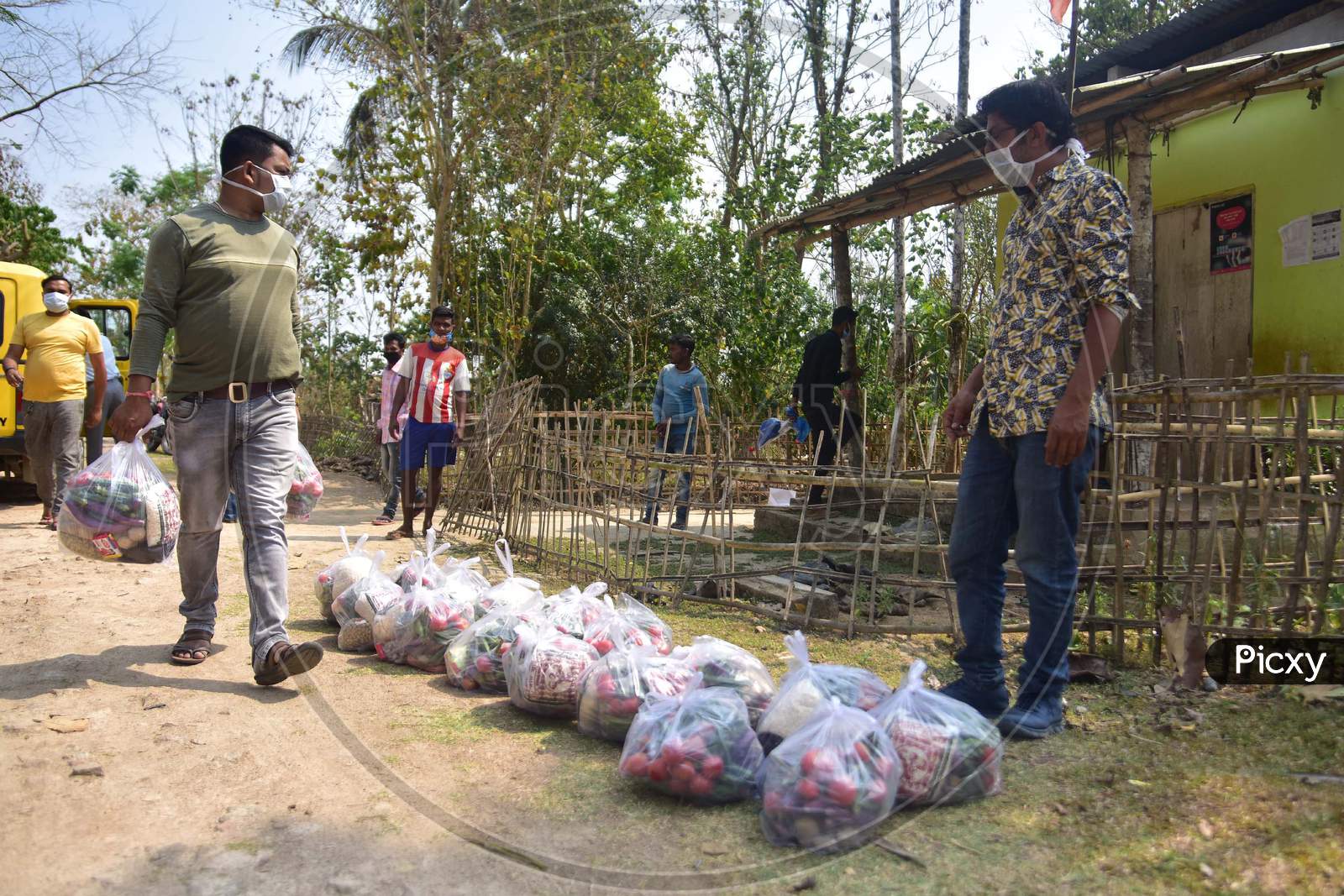 Volunteers Arrange Ration Before Distributing It Among Tea Tribe People During A Nationwide Lockdown Imposed In The Wake Of Coronavirus Pandemic At Samaguri In Nagaon District Of Assam