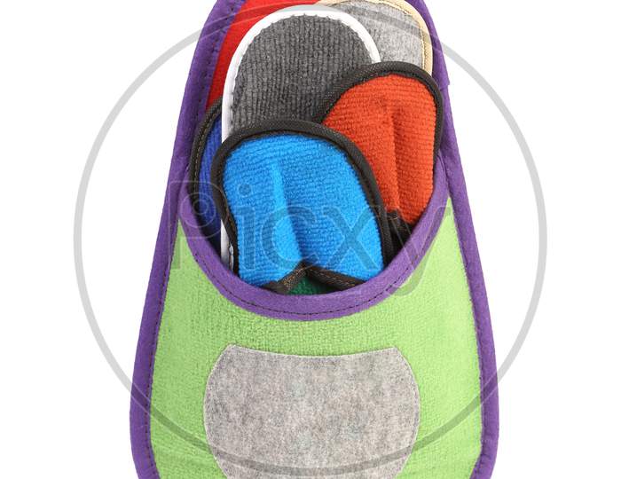 Colourful Slippers Into Big Slipper. Isolated On A White Background.