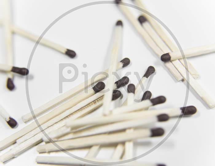 Matches With Black Heads On The White Background. Selective Focus.