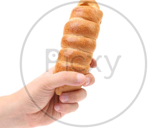 Hand Holds Hot Dog Baked. Isolated On A White Background.