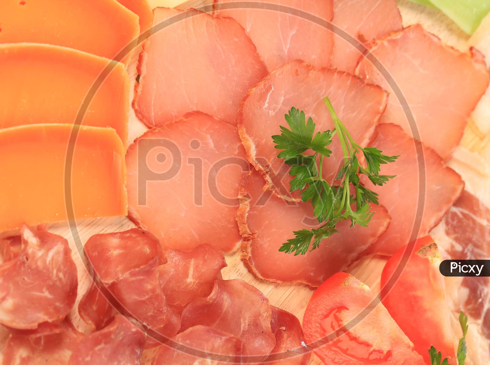 Various Meat Slices And Parsley. Whole Background.