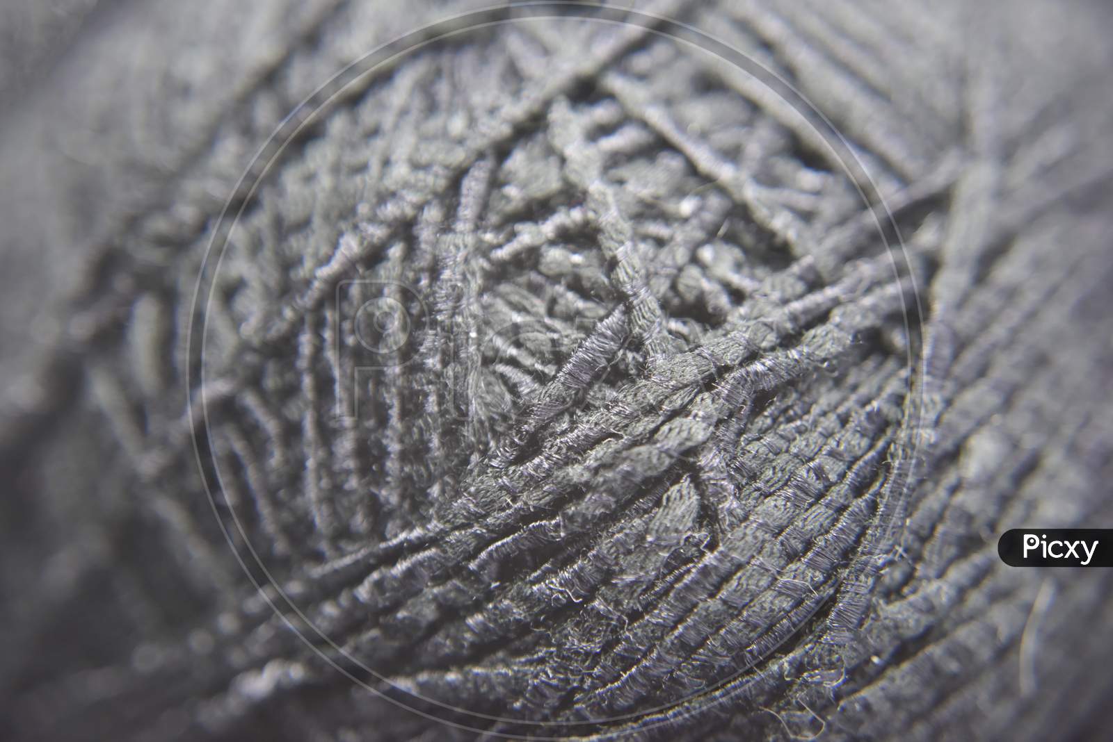 Pattern Of Thick Black Knitting Threads In The Ball. Close-Up Look. Tight Knot Chaos Concept.