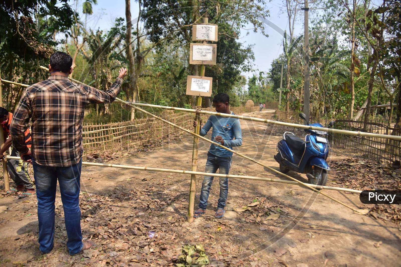 Barricade Made Of Bamboo Is Laid Across A Road By Residents During A 21-Day Nationwide Lockdown To Limit The Spreading Of Coronavirus Disease (Covid-19), At A Village In Nagaon District Of Assam