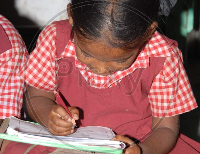 Indian School Kids Reading In an Classroom