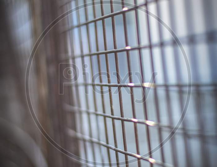 closeup of steel window in cage