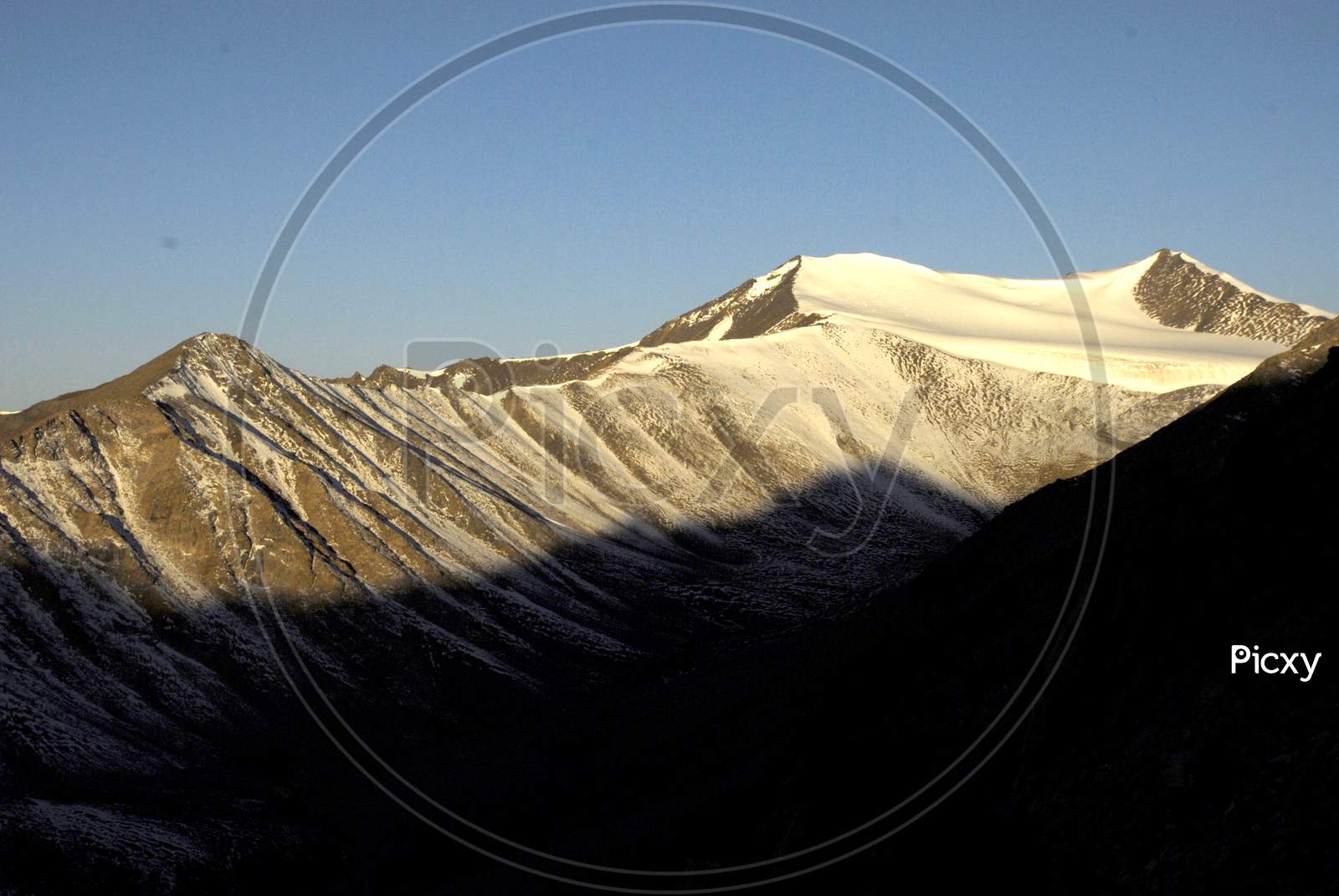 Landscape Of Snow capped Mountains And Blue Sky In Ladakh