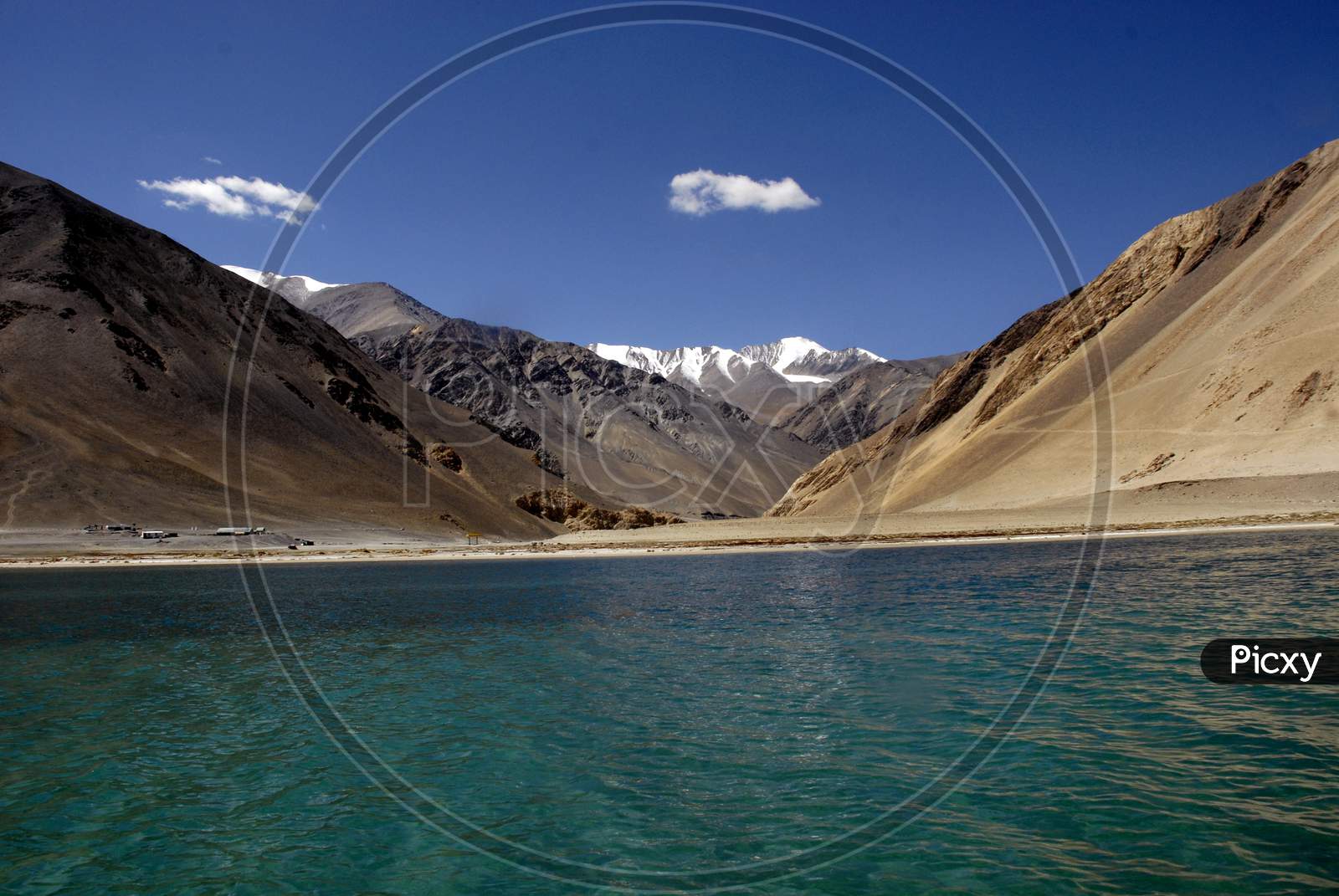 Pangong Lake With a View Of Snow Capped Mountains In Ladakh