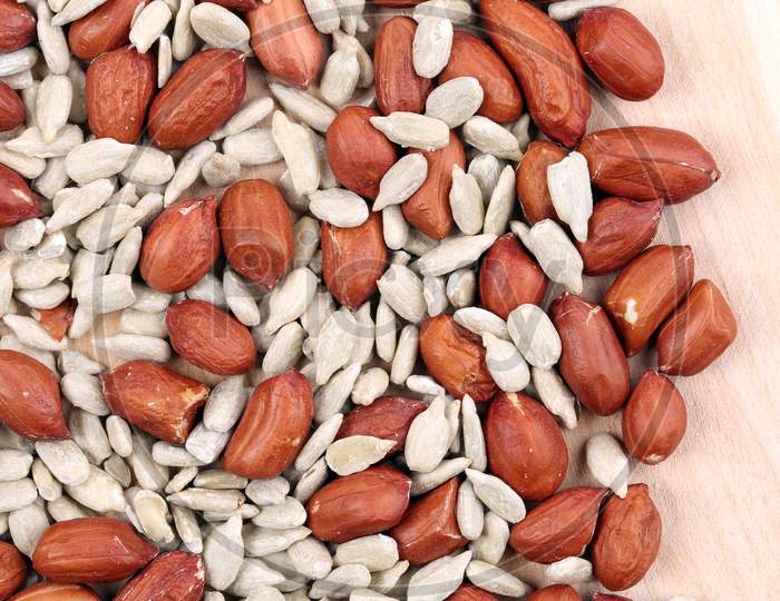 Close Up Of Peanuts And Sunflower Seeds. Whole Background.