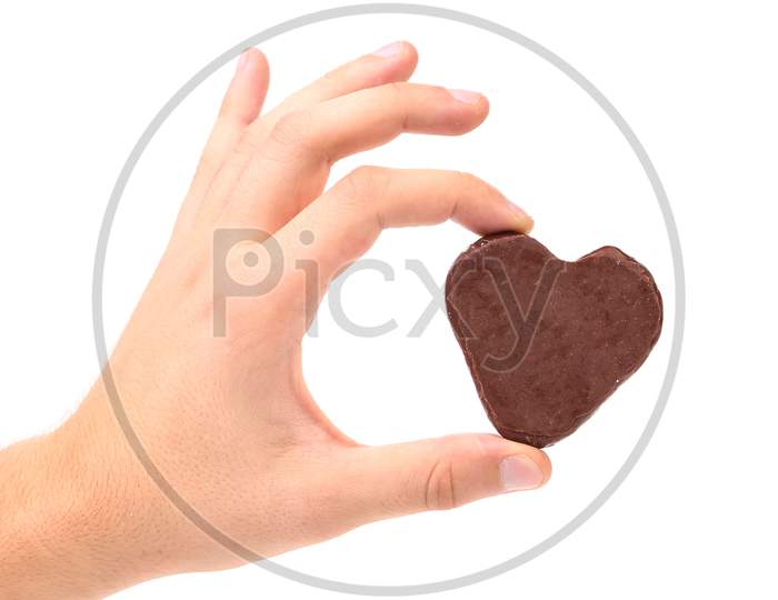 White Kiss Cookies With Chocolate In Hand. Isolated On A White Background.