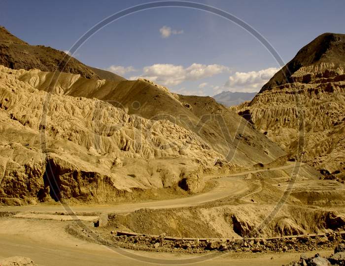 Roads in Sand Terrains Or Mountains With Blue Sky Composition In Ladakh