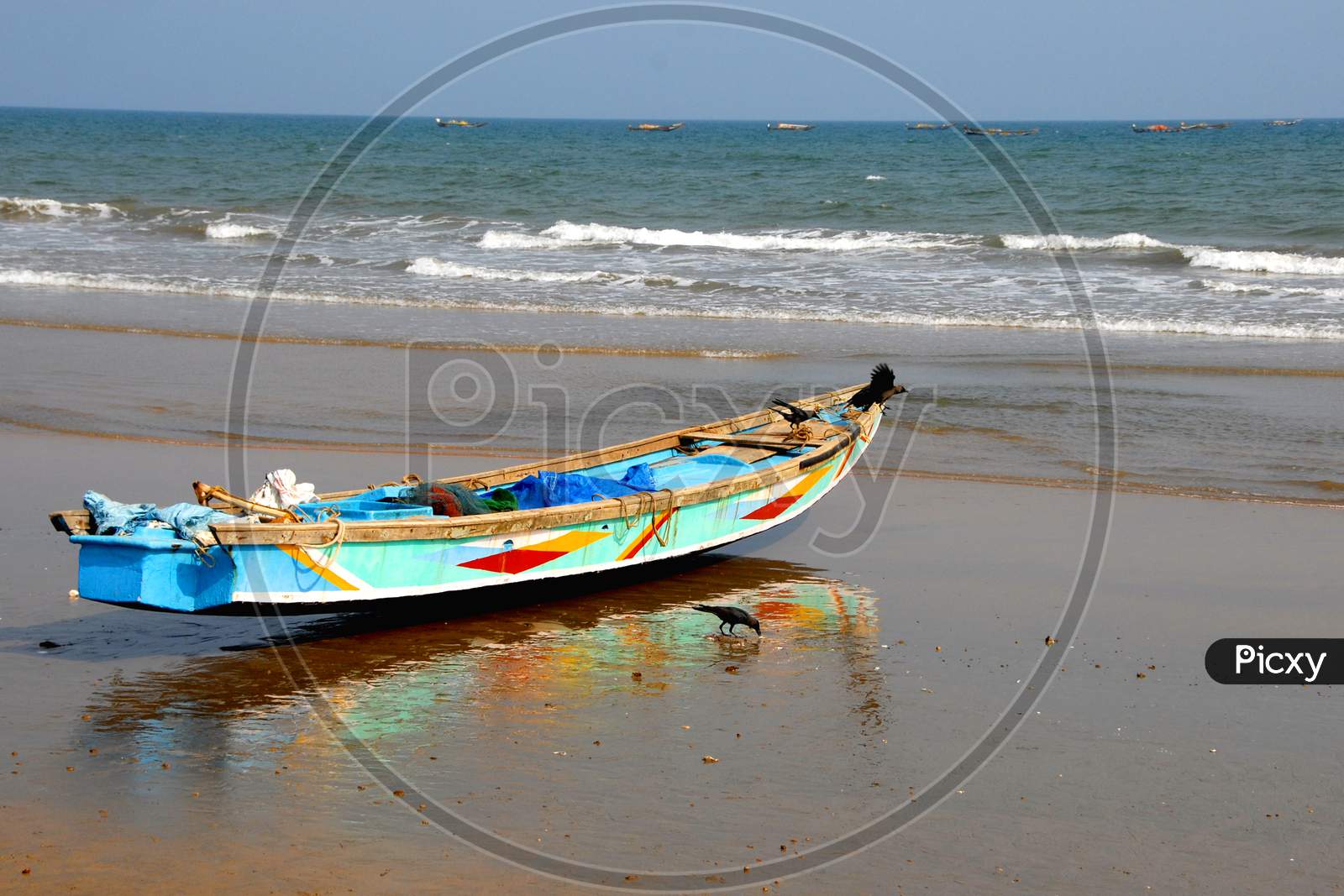 Fishing Boats At Beach With Sea in Background