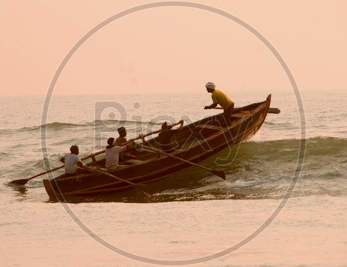 Fisherman Going To Fishing in Boats On Tides Over a Sea