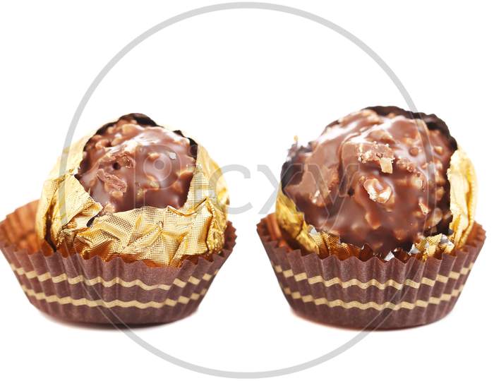 Close Up Of Chocolate Gold Bonbon. Isolated On A White Background.