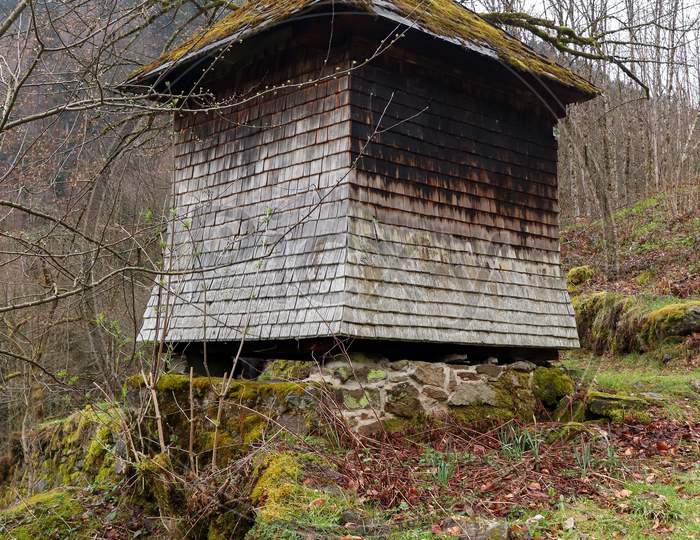 Small Hut On A Hiking Path In The Black Forest Of Germany On A Grey Winter Day.