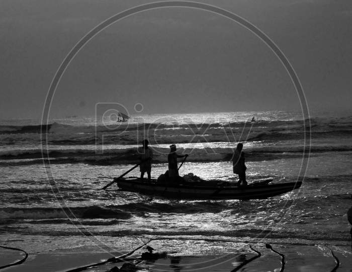 Silhouette Of fisherman On Tides Over a Sea Going For Fishing