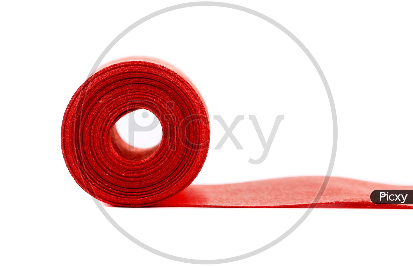 Red Silk Ribbon Roll. Isolated On A White Background.