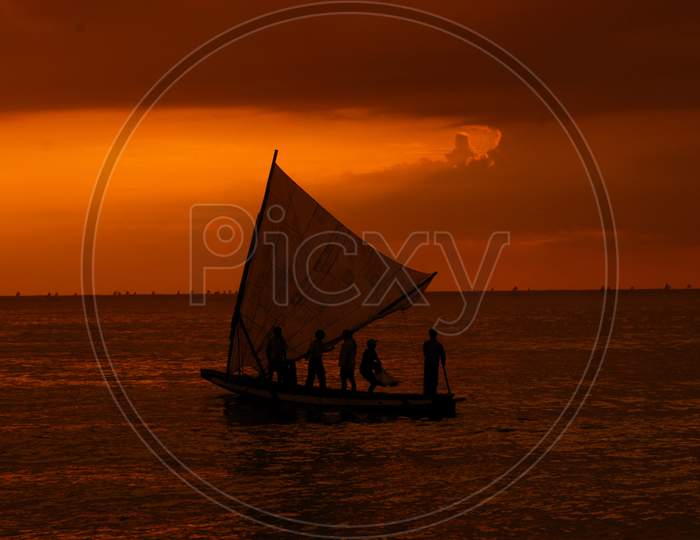 Silhouette Of Fisher Man in Fishing Boat on Sea