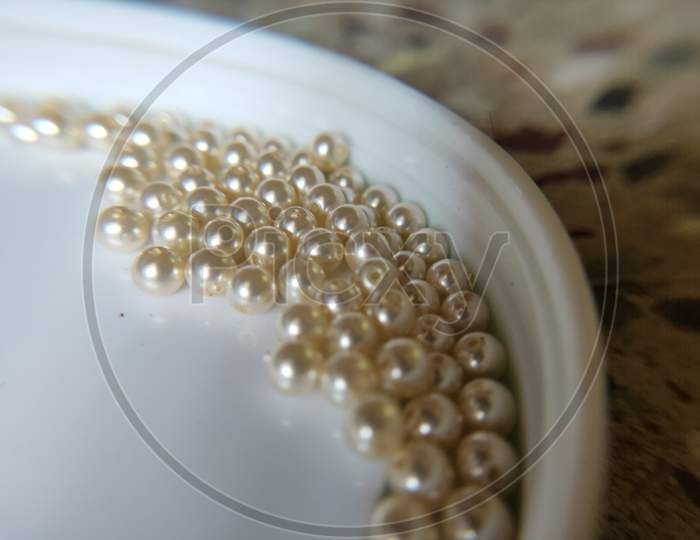 American pearls on white background. Close up of American pearls.