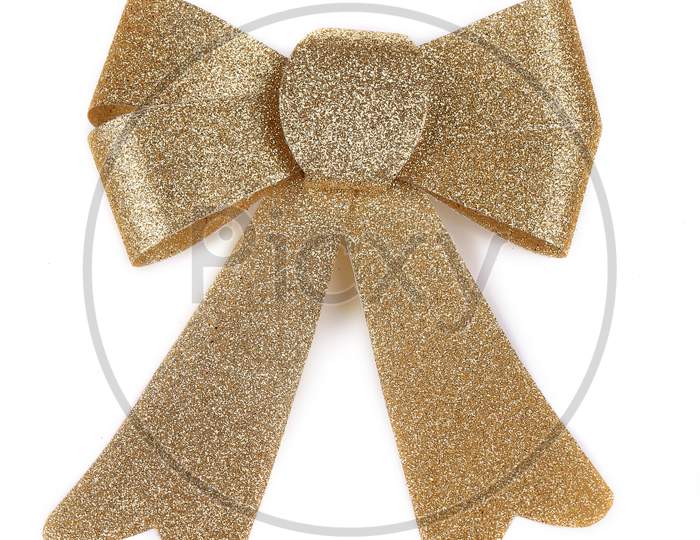Christmas Golden Ribbon Decoration. Isolated On A White Background.