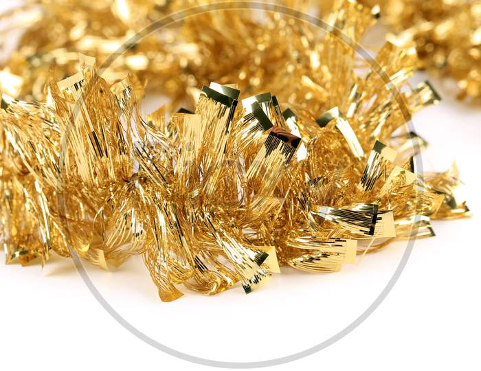 Christmas Golden Tinsel. Close Up. Whole Background.