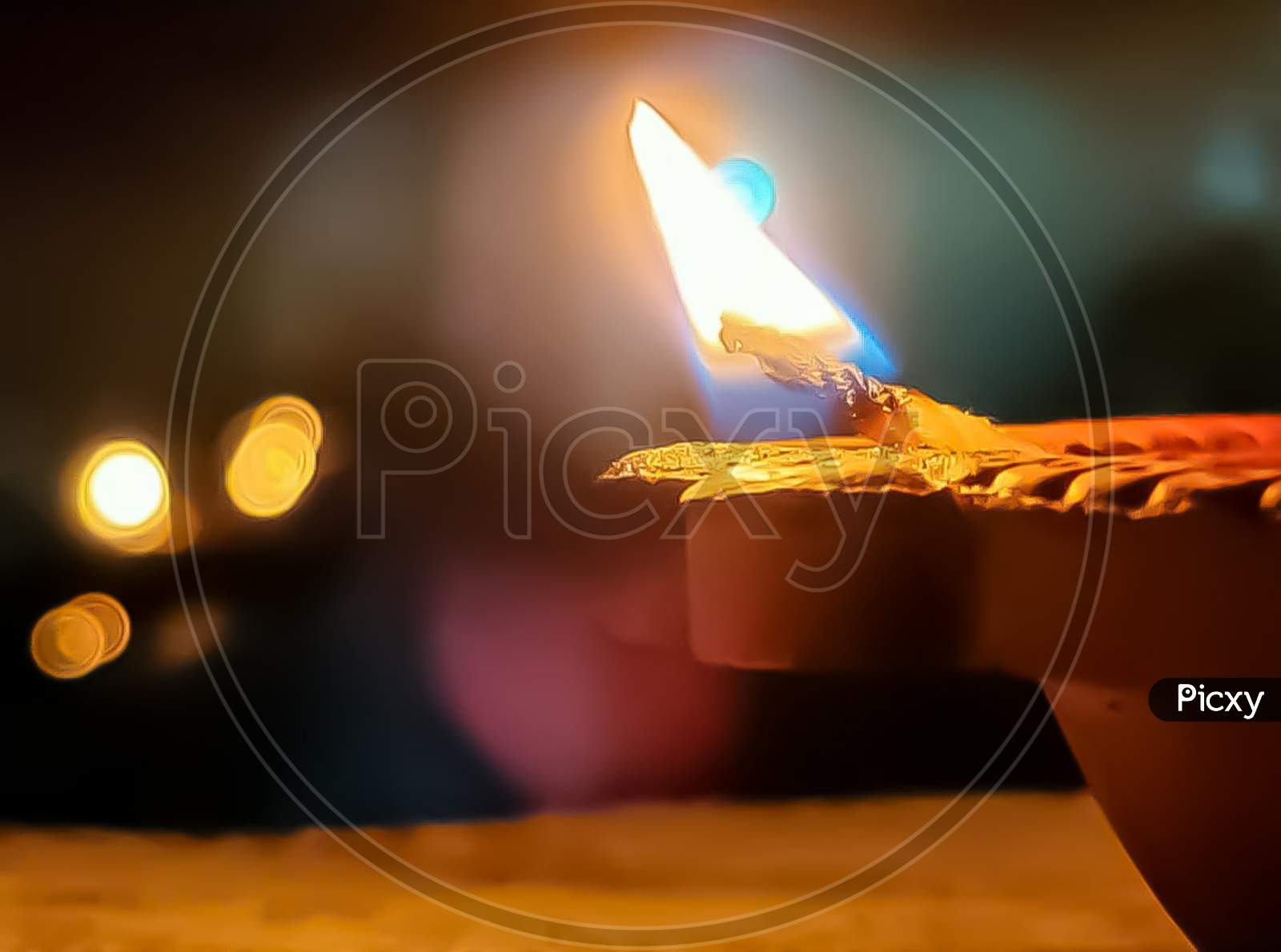 Beautiful Jyoti of diya (candle) glowing in house temple, Indian tradition to glow brass diya or candle with pure ghee. 