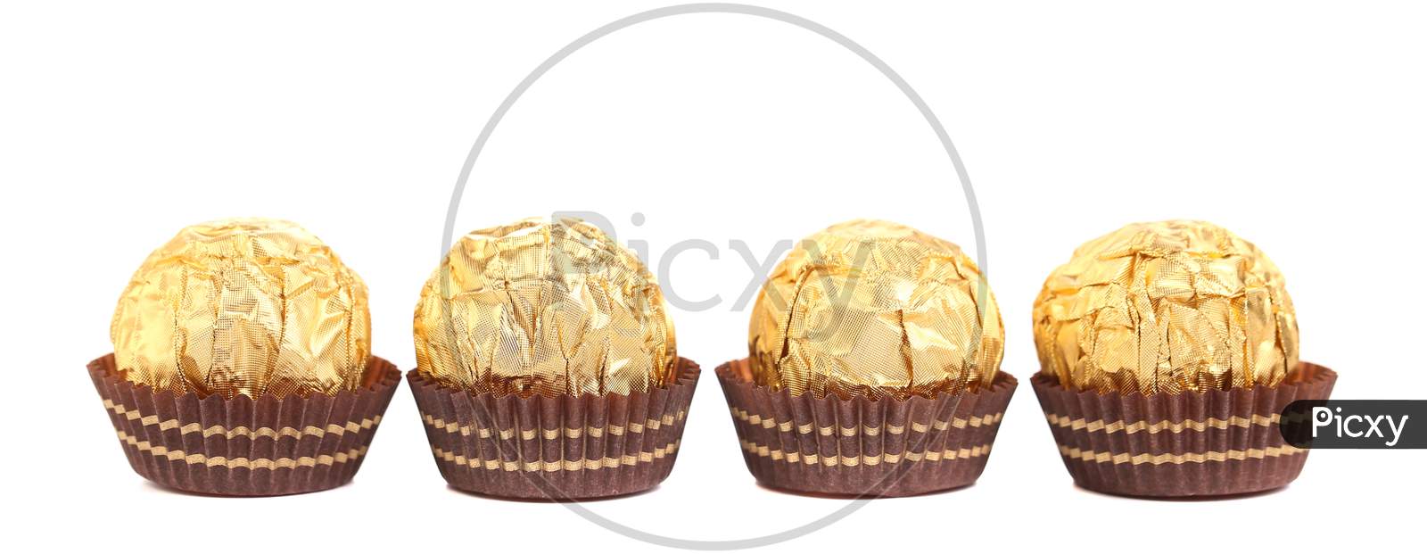 Four In Row Chocolate Bonbons. Isolated On A White Background.