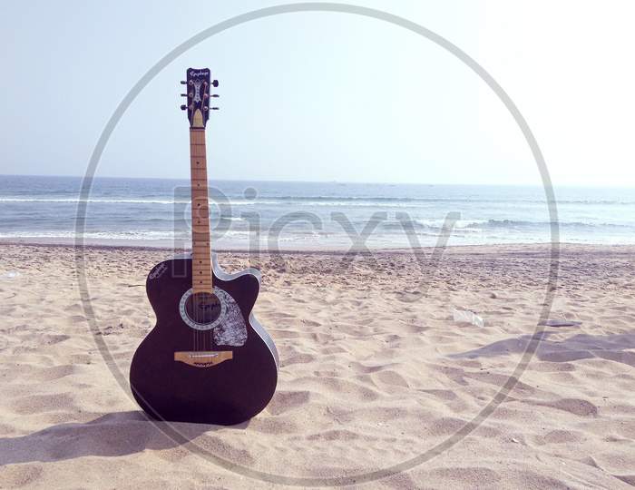Guitar at a beach 