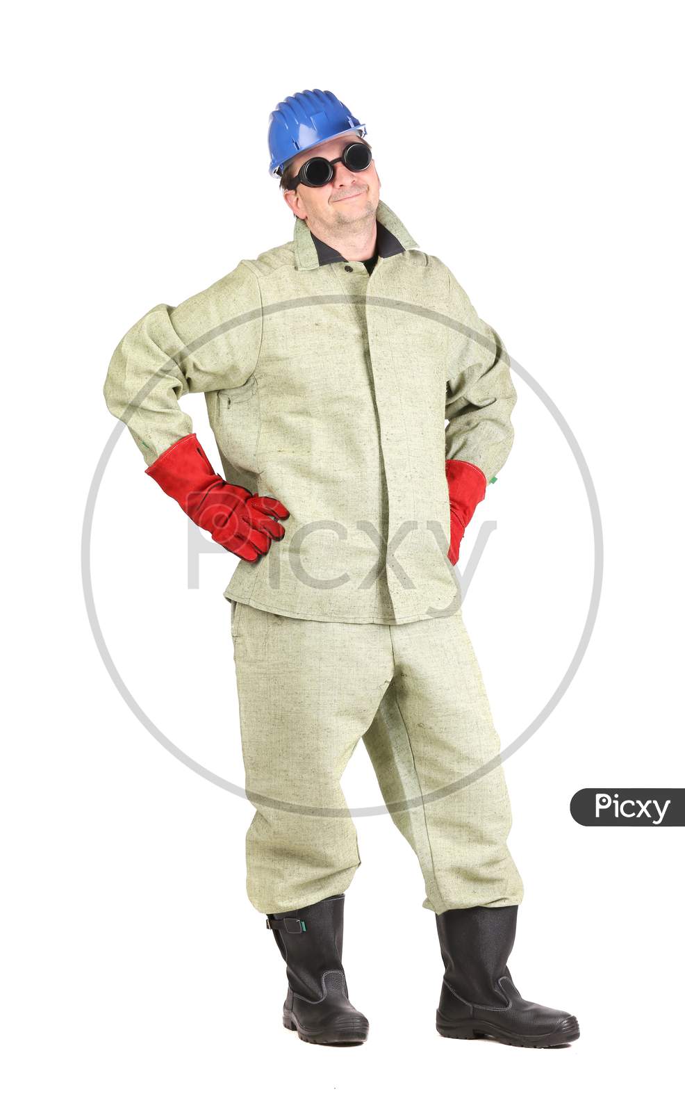 Welder With Arms On Waist. Isolated On A White Background.