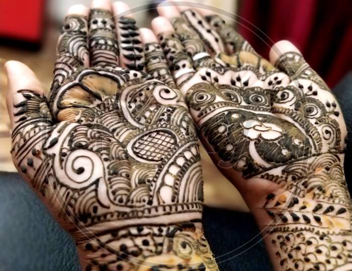 Beautifully Decorated Indian Hands With Mehandi Typically Done For Weddings