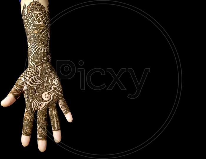 Beautiful Mehendi Design On Hands on Black Background With Copy Space For Text
