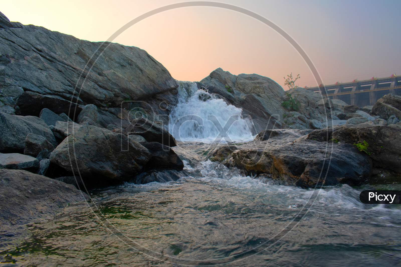 Closeup Image Of Water Flowing Between The Rocks