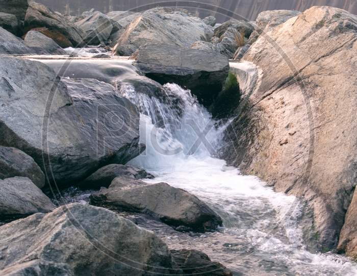 Closeup Image Of A Small Waterfall Flowing
