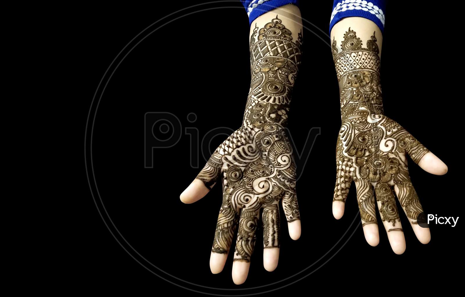 Beautiful Mehendi Design On Hands on Black Background With Copy Space For Text