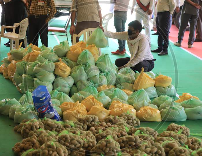 Government Employees Loading Food  Bags For Distributing Them to Poor People During Lockdown Period For Corona Virus Or COVID-19 Pandemic In India. Prayagraj