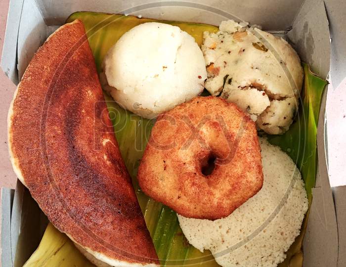 Combo south indian vegetarian breakfast packed in a take away box in Bengaluru.