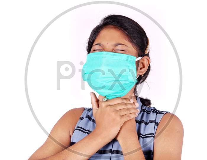 Young woman wearing a face mask to avoid dust allergy and to get protection against virus.neck pain is the symptoms of Coronavirus Covid 19