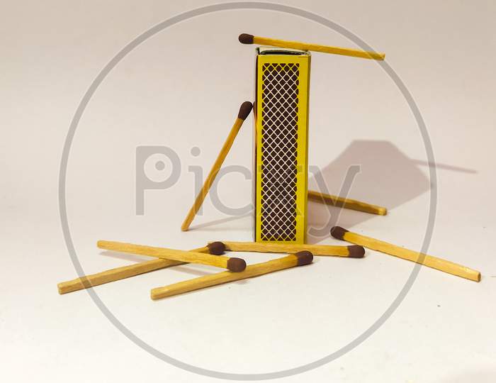 Matchsticks and matchbox with close look white background indoor photography.