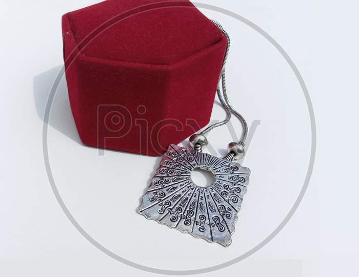 White metal ethnic jewelry with a box.