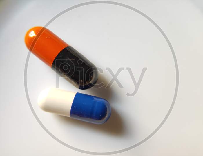 Capsules on white background. Macro photography of medicines on white background. Drugs in capsule form.