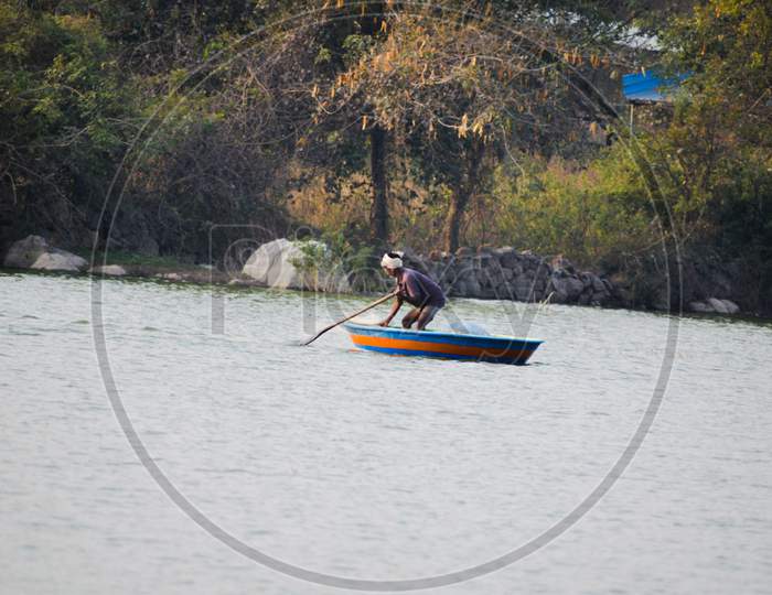 Fishermen fishing in local lake