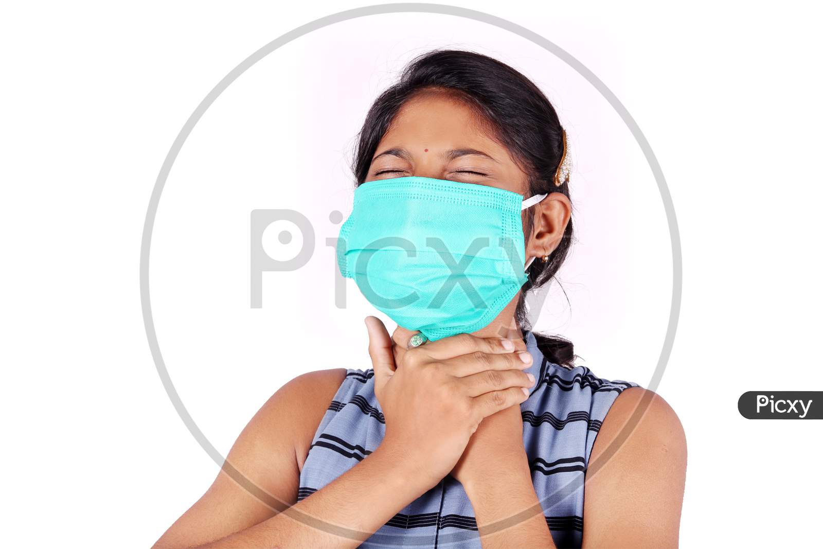 Young woman wearing a face mask to avoid dust allergy and to get protection against virus.neck pain is the symptoms of Coronavirus Covid 19