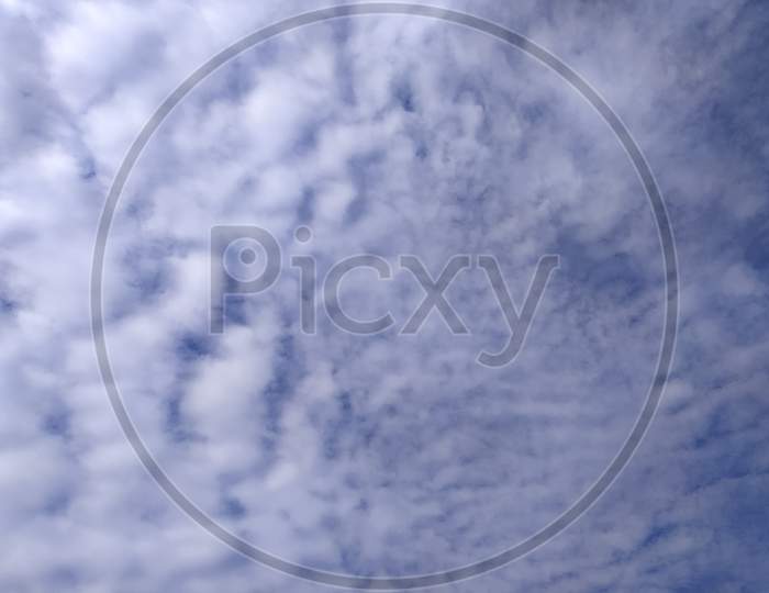 Cotton Clouds in Blue Sky Forming a background