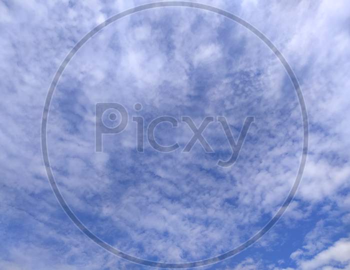 Cotton Clouds in Blue Sky Forming a background