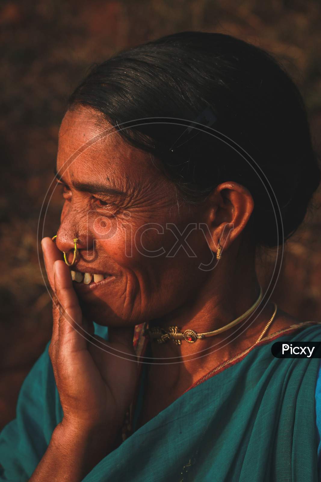 A tribal woman smiling 