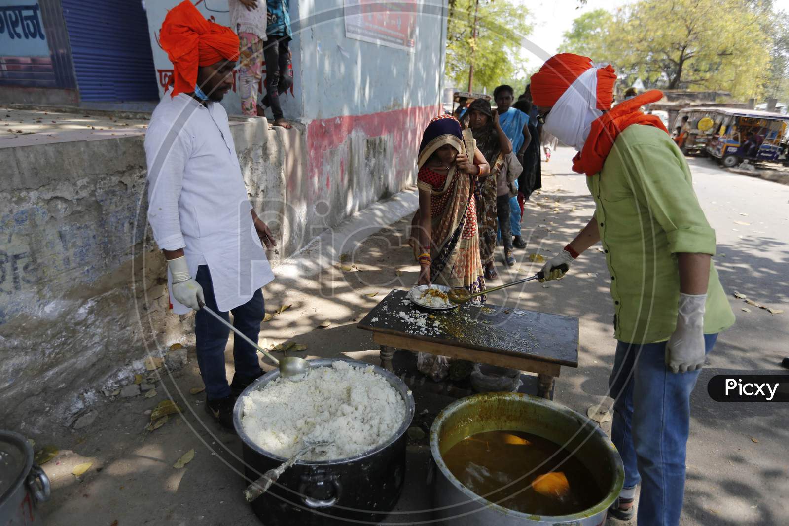 People Distributing Food for  Poor People During A 21-Day Nationwide Lockdown To Limit The Spreading Of Coronavirus Disease (Covid-19), Prayagraj, April 4, 2020.