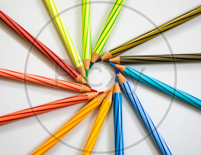 Color Pencils arranged in a circle On white Background