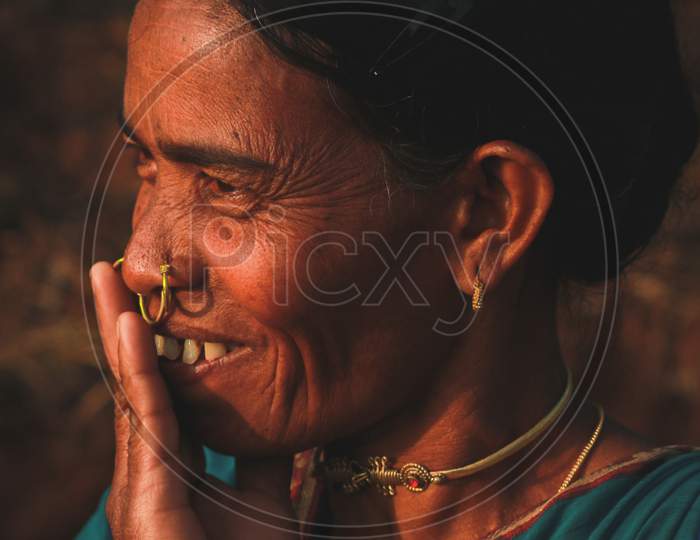 A tribal woman smiling 