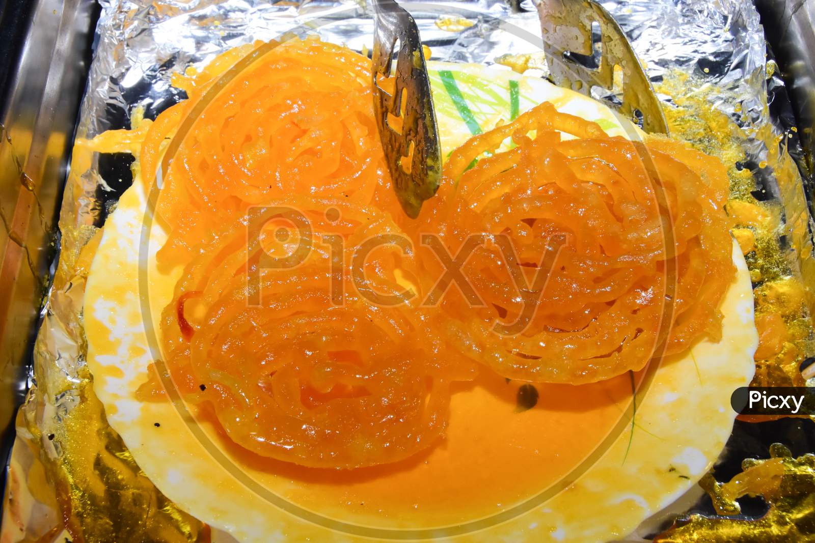 Indian delicious sweet jalebi placed on a plate